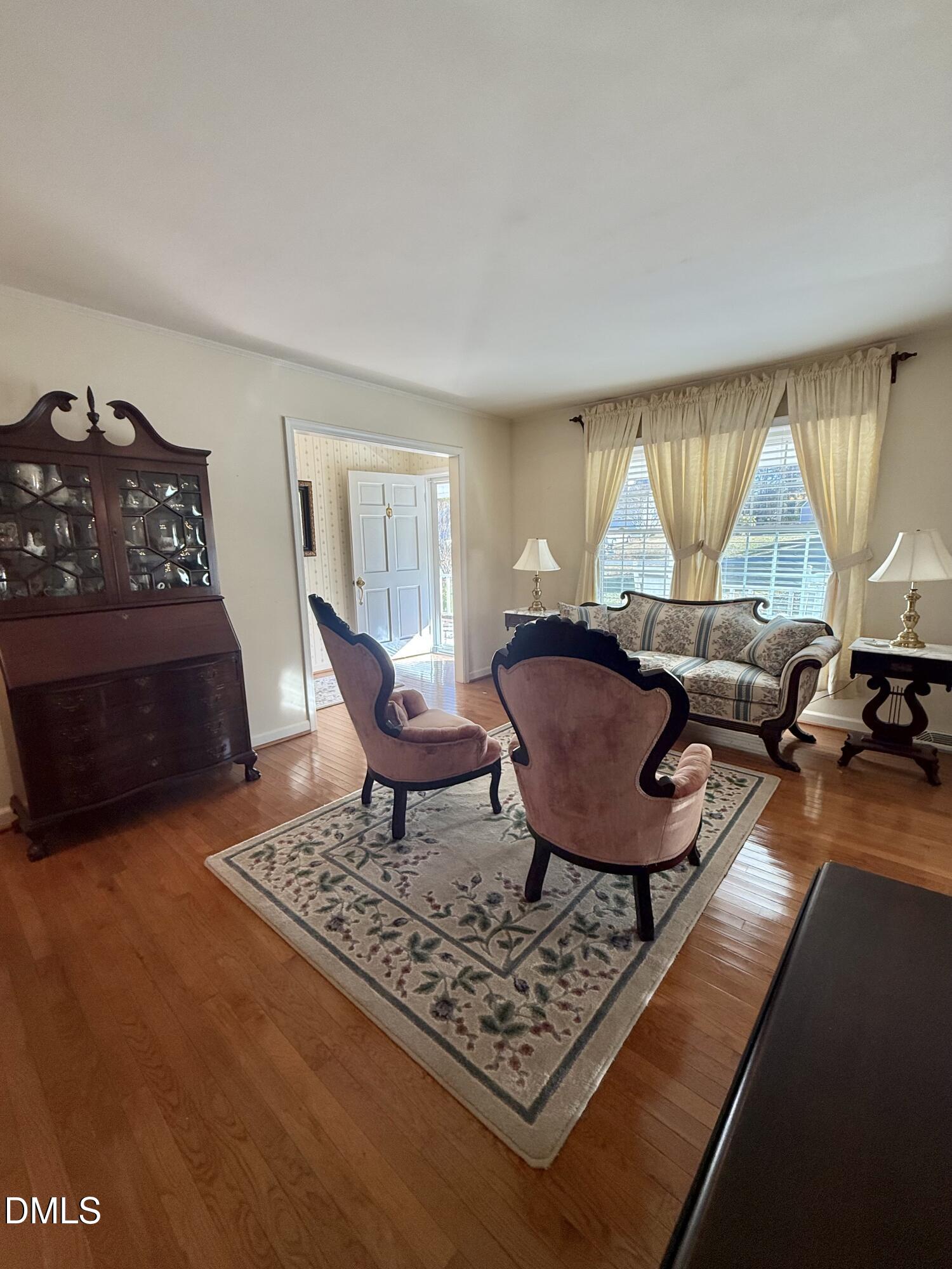 424 Tanglewood Circle Roxboro, NC 27573 - Photo 6 of 47 a living room with furniture a rug a window and a couch