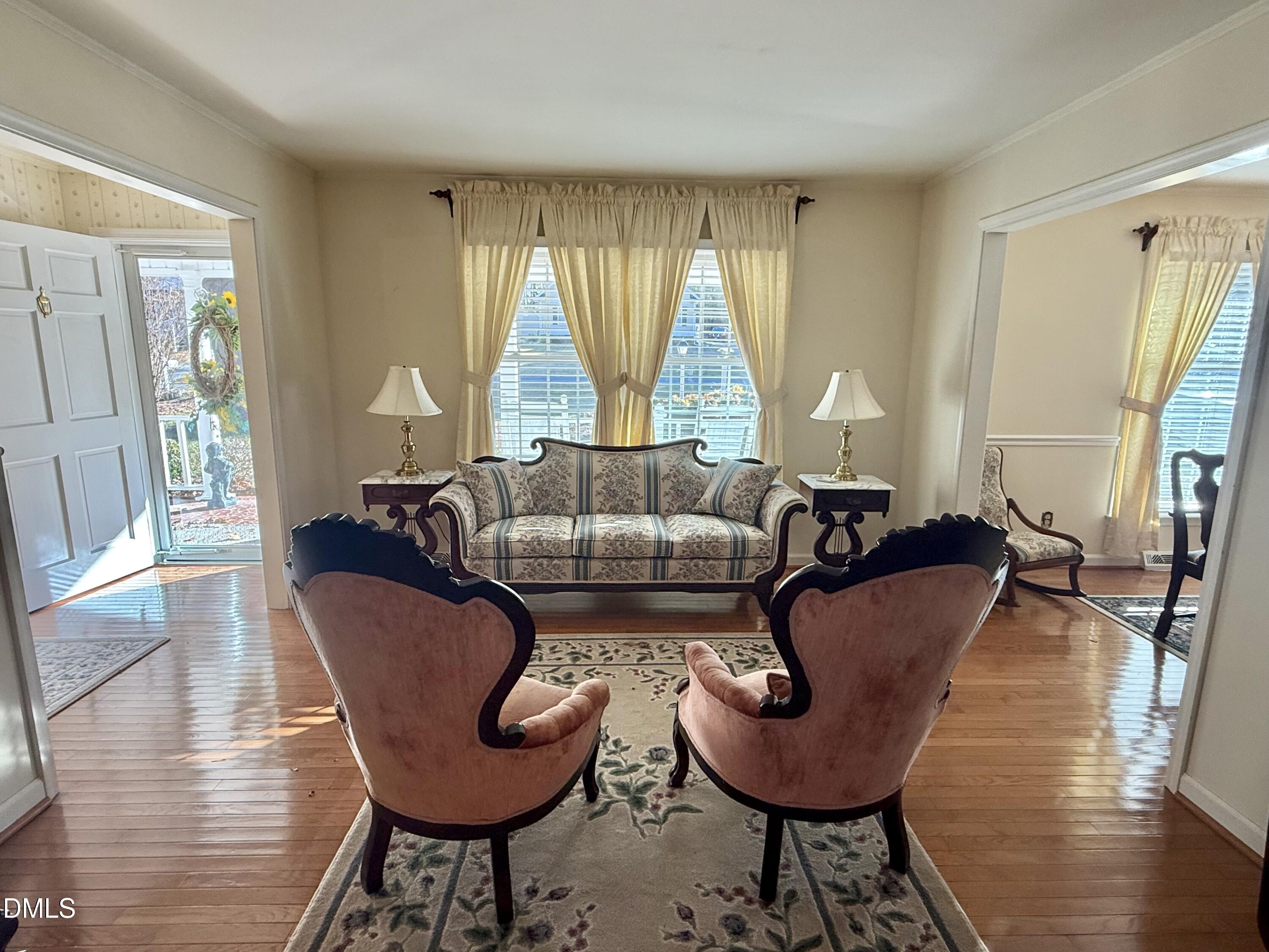 424 Tanglewood Circle Roxboro, NC 27573 - Photo 8 of 47 a living room with furniture and a large window