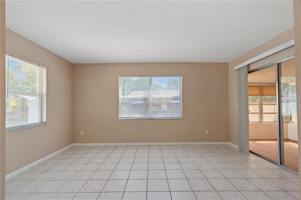 4008 Windswept Avenue Spring Hill, FL 34606 - Photo 14 of 32 an empty room with windows