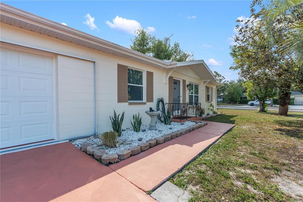 4008 Windswept Avenue Spring Hill, FL 34606 - Photo 2 of 32 a front view of house with yard and green space