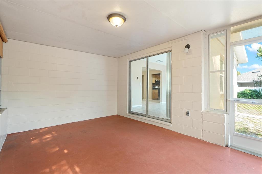 4008 Windswept Avenue Spring Hill, FL 34606 - Photo 26 of 32 an empty room with windows