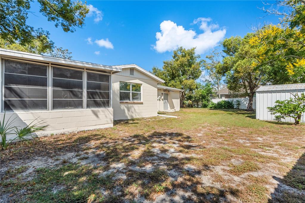 4008 Windswept Avenue Spring Hill, FL 34606 - Photo 29 of 32 a house with yard in front of it