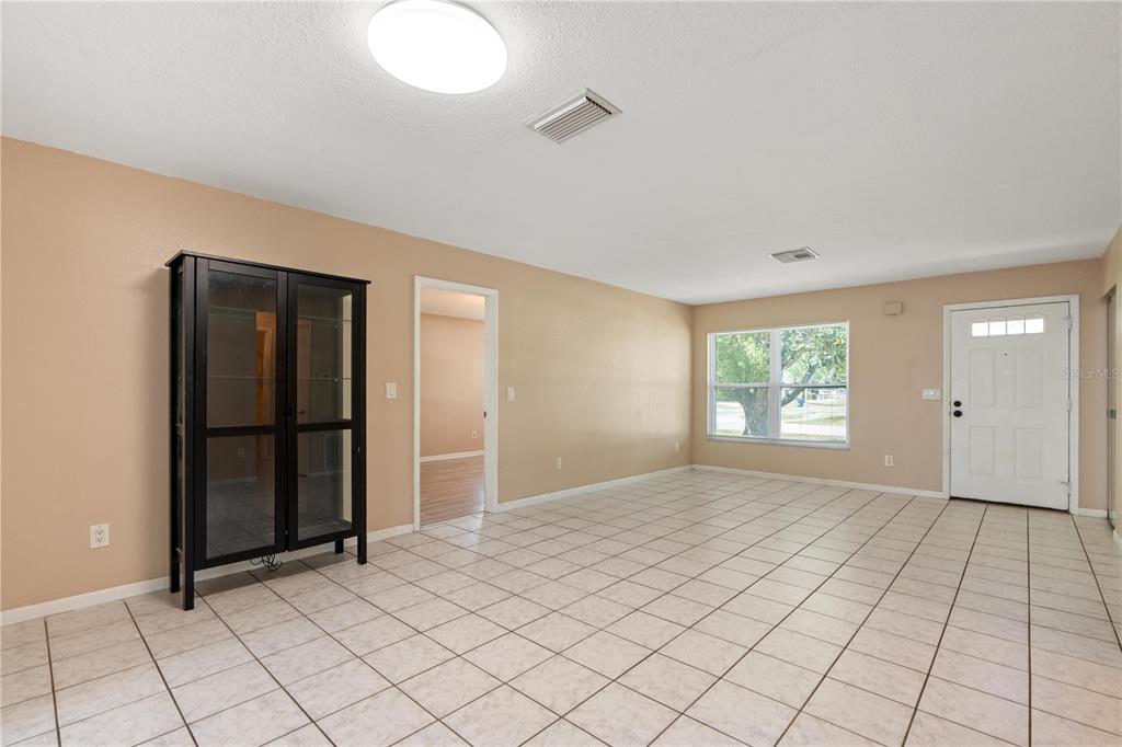 4008 Windswept Avenue Spring Hill, FL 34606 - Photo 6 of 32 an empty room with windows
