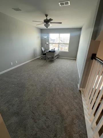 wooden floor in a hall with a window