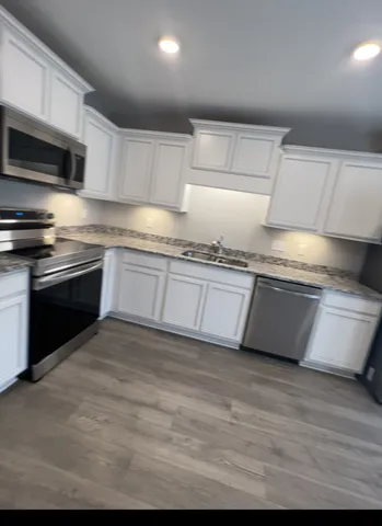 a view of storage and utility room with racks on the wall