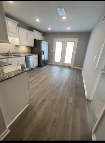 a bathroom with a sink a toilet and a shower