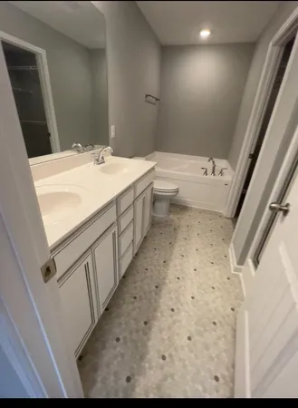 a view of an empty room with gym equipment