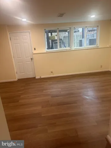 a white toilet sitting next to a shower