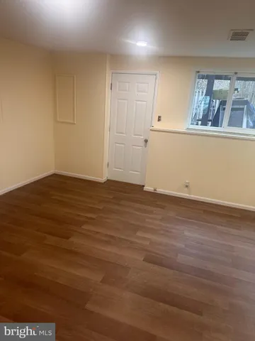 a kitchen with stainless steel appliances wooden cabinets and a granite counter top