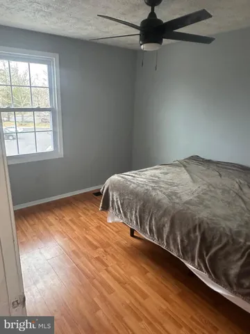 a view of an empty room with a chandelier