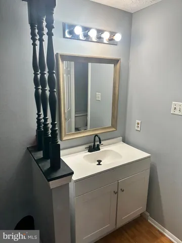 a white toilet sitting next to a shower