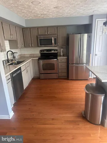 a view of a house with a snow in the yard