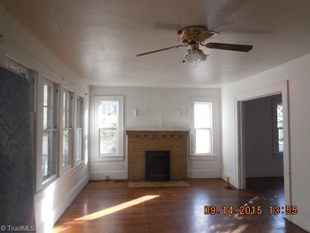 1006 Tipton Street High Point, NC 27262 - Photo 5 of 11 LIVING ROOM WITH FIREPLACE AND HARDWOOD FLOORING