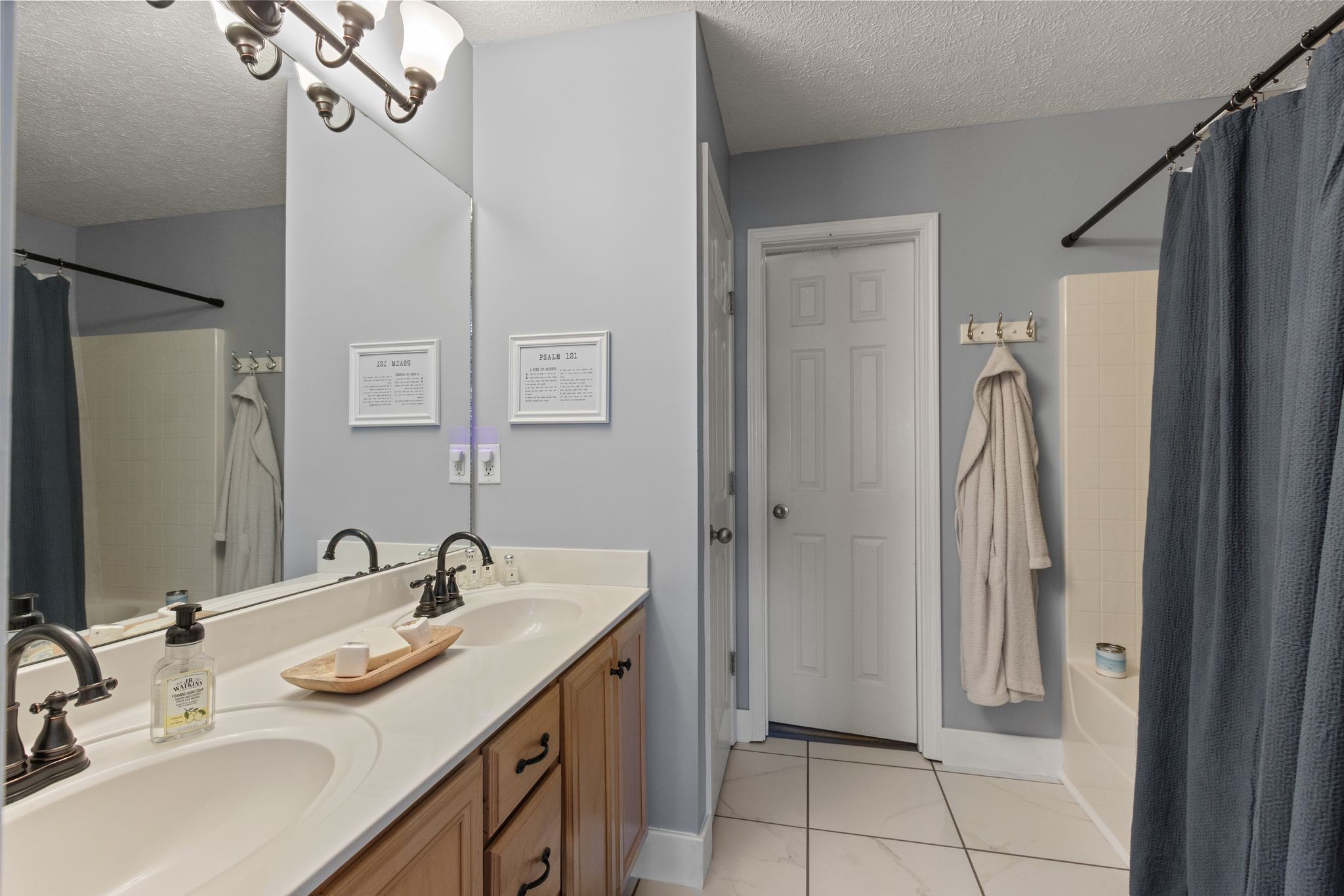 3003 Pandell Court Spring Hill, TN 37174 - Photo 12 of 22 a bathroom with a sink vanity and a mirror