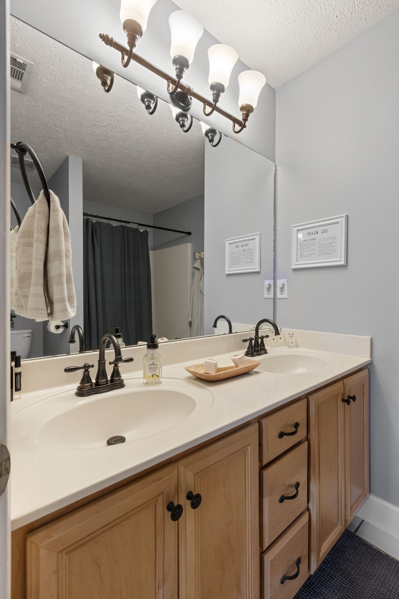 3003 Pandell Court Spring Hill, TN 37174 - Photo 13 of 22 a bathroom with a sink and a mirror