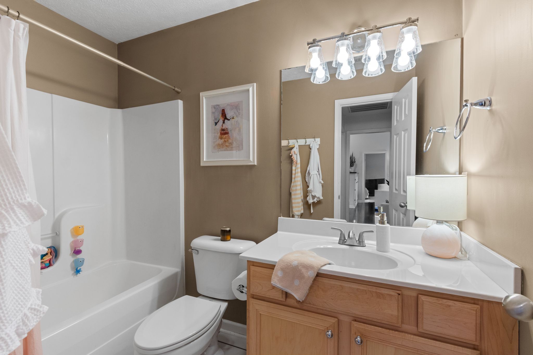 3003 Pandell Court Spring Hill, TN 37174 - Photo 17 of 22 a bathroom with a sink vanity granite toilet tub and shower