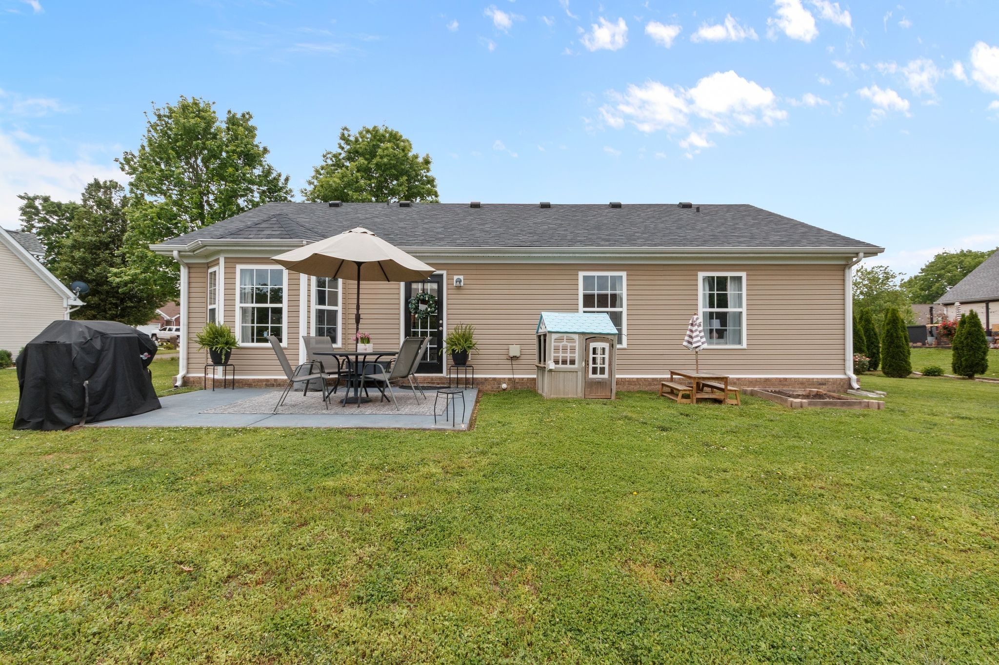 3003 Pandell Court Spring Hill, TN 37174 - Photo 21 of 22 a view of a house with a backyard porch and sitting area