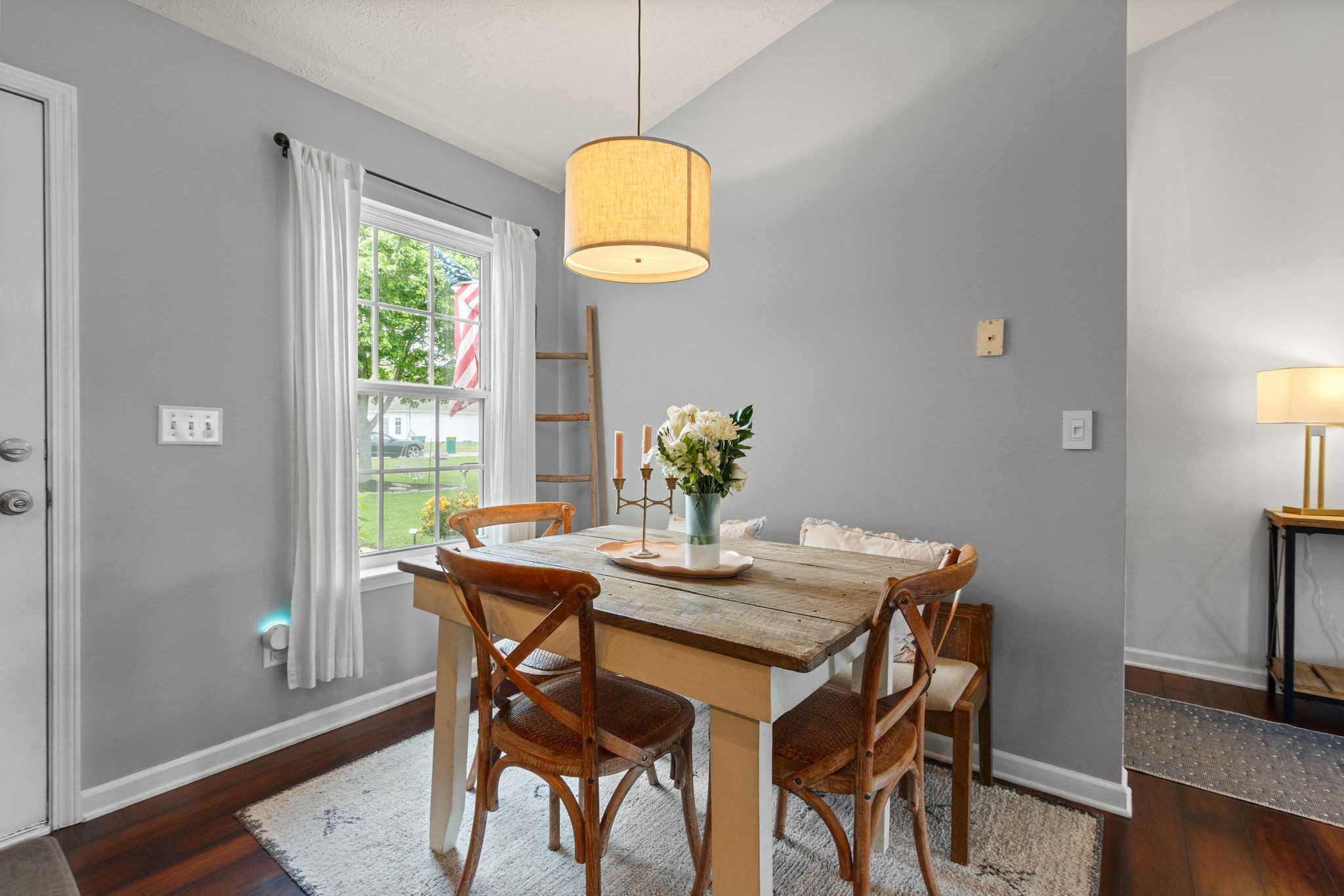 3003 Pandell Court Spring Hill, TN 37174 - Photo 9 of 22 a view of a dining room with furniture window and wooden floor