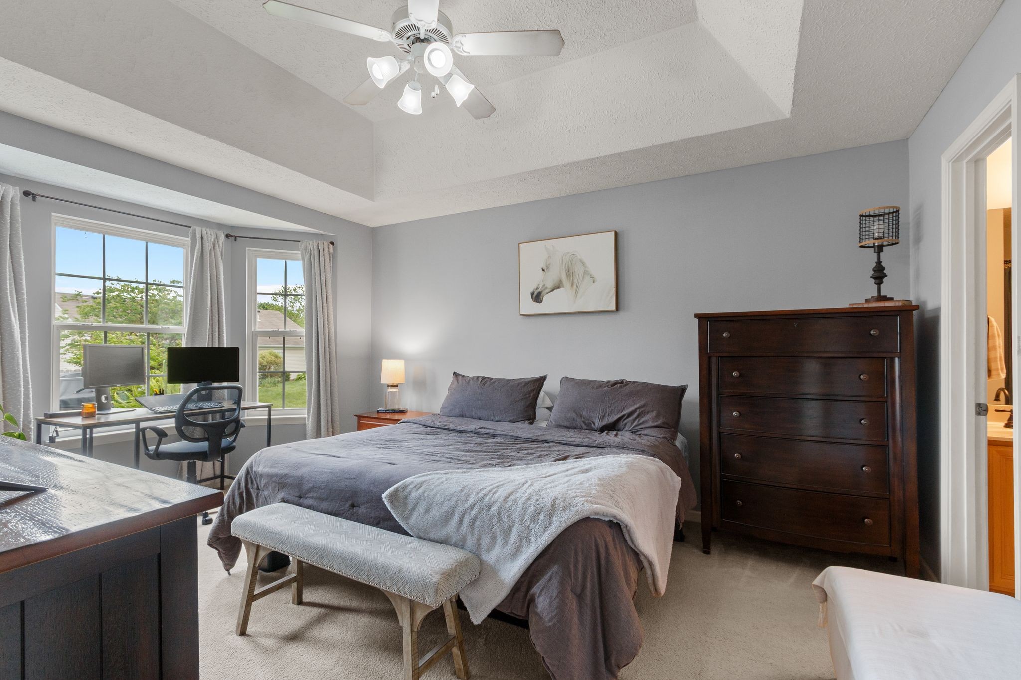3003 Pandell Court Spring Hill, TN 37174 - Photo 10 of 22 a bedroom with a bed and a chandelier