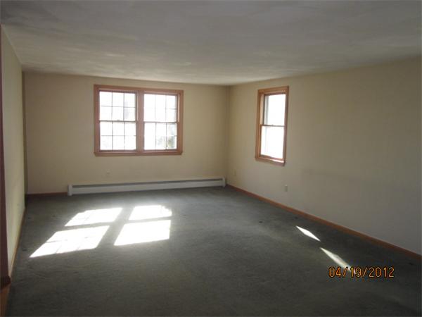 24 Hollis Road Lunenburg, MA 01462 - Photo 7 of 27 a view of an empty room with a window