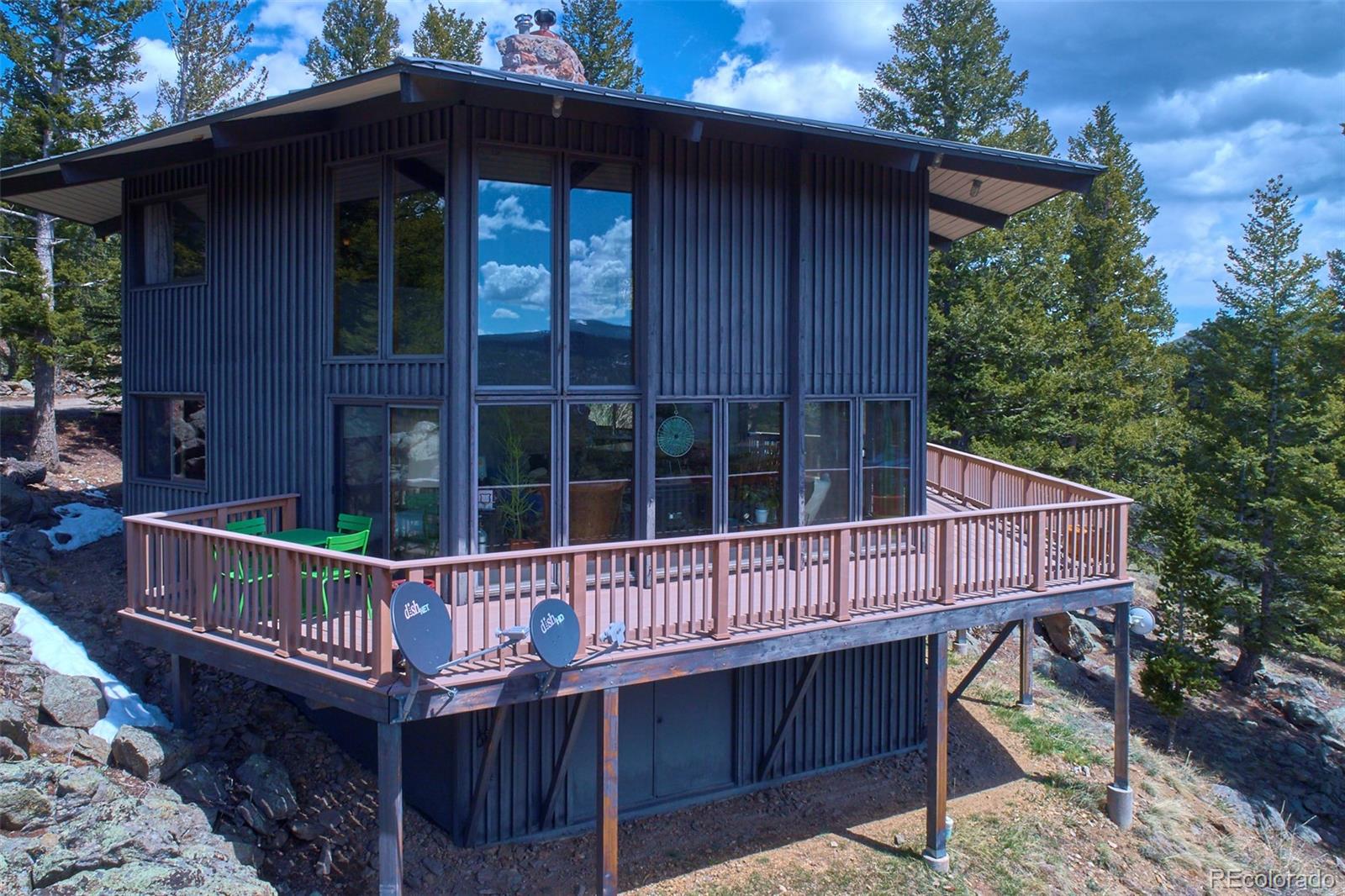 918 Ridge Road Nederland, CO 80466 - Photo 29 of 35 a wooden deck with a small yard