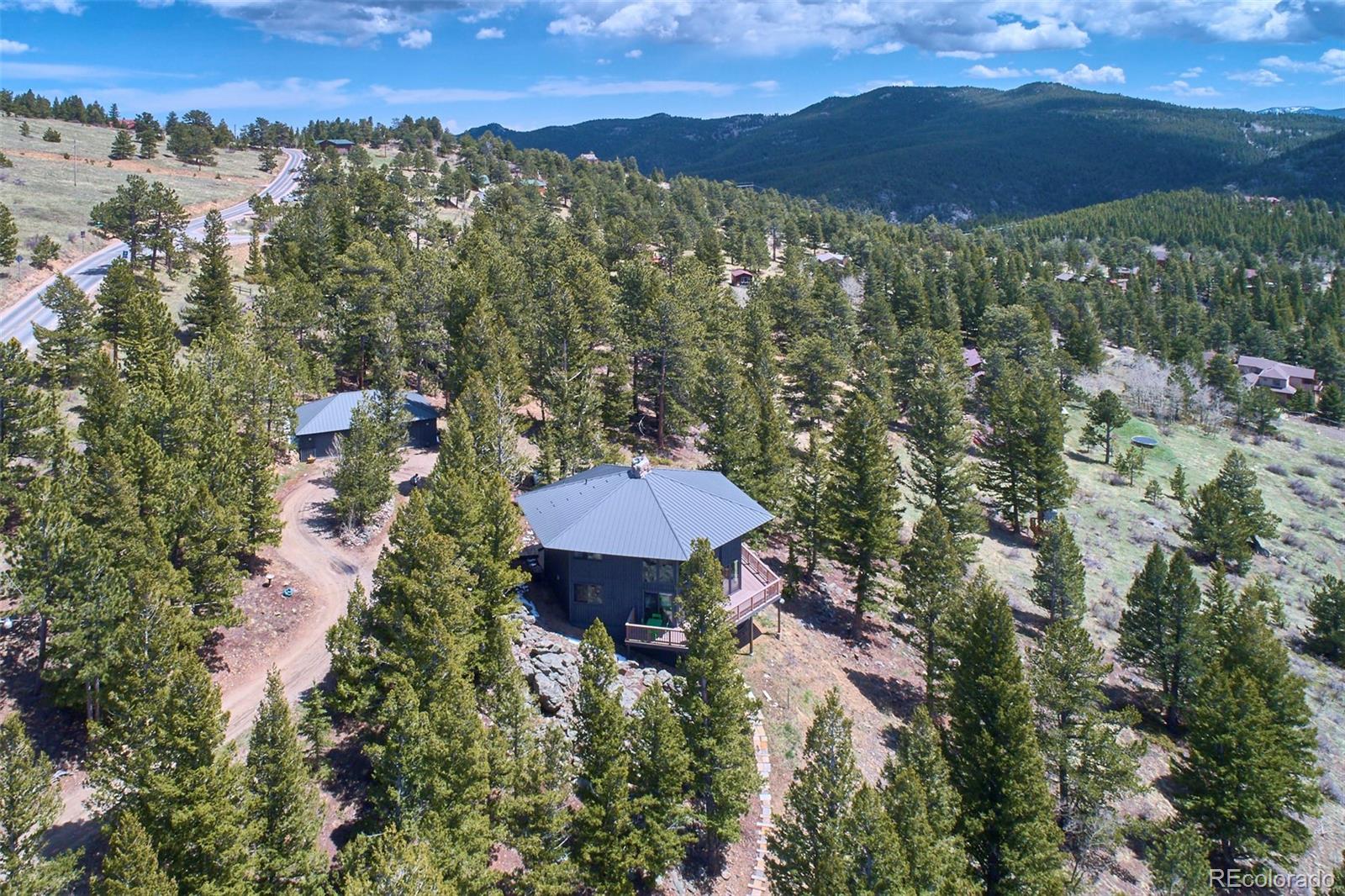 918 Ridge Road Nederland, CO 80466 - Photo 31 of 35 an aerial view of a house with a yard