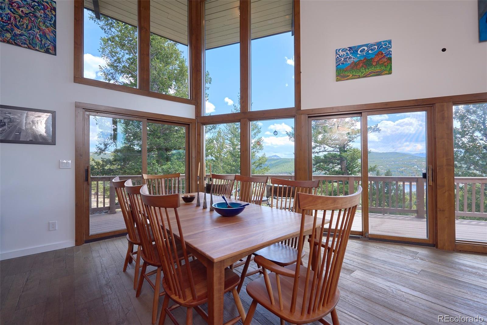 918 Ridge Road Nederland, CO 80466 - Photo 9 of 35 a view of a dining room with furniture window and wooden floor