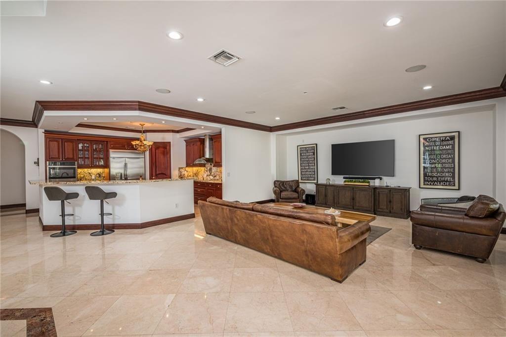 6465 Southwest 178th Avenue Southwest Ranches, FL 33331 - Photo 12 of 36 a living room with furniture and a flat screen tv