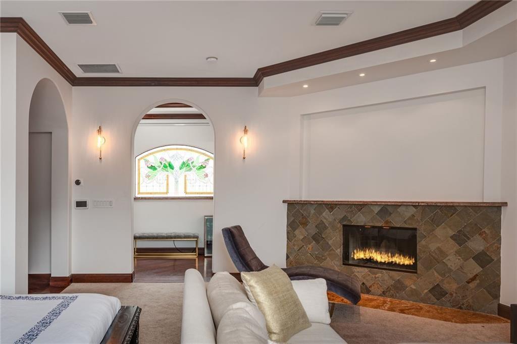 6465 Southwest 178th Avenue Southwest Ranches, FL 33331 - Photo 16 of 36 a living room with furniture a rug and a fireplace