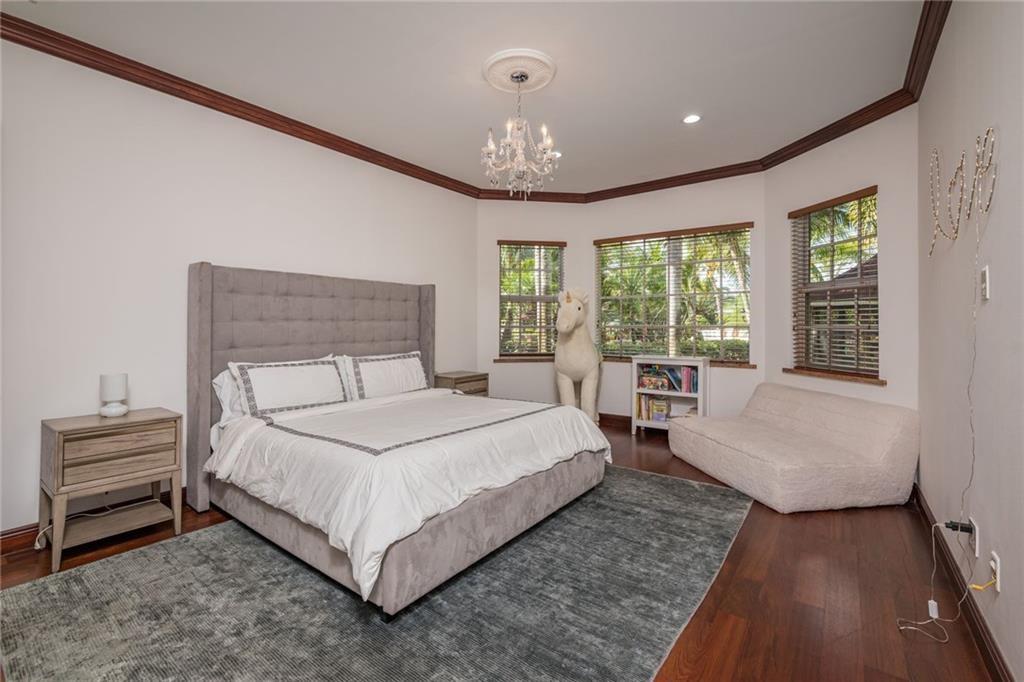 6465 Southwest 178th Avenue Southwest Ranches, FL 33331 - Photo 19 of 36 a bedroom with a large bed and a large window