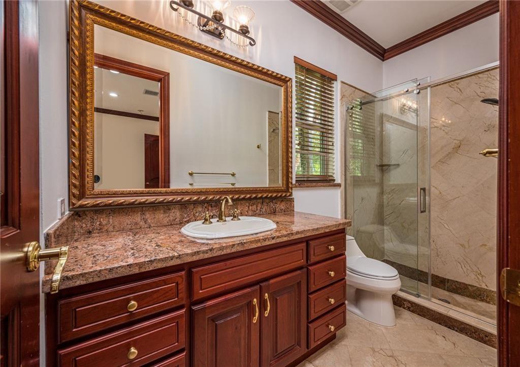6465 Southwest 178th Avenue Southwest Ranches, FL 33331 - Photo 20 of 36 a bathroom with a sink a toilet and shower