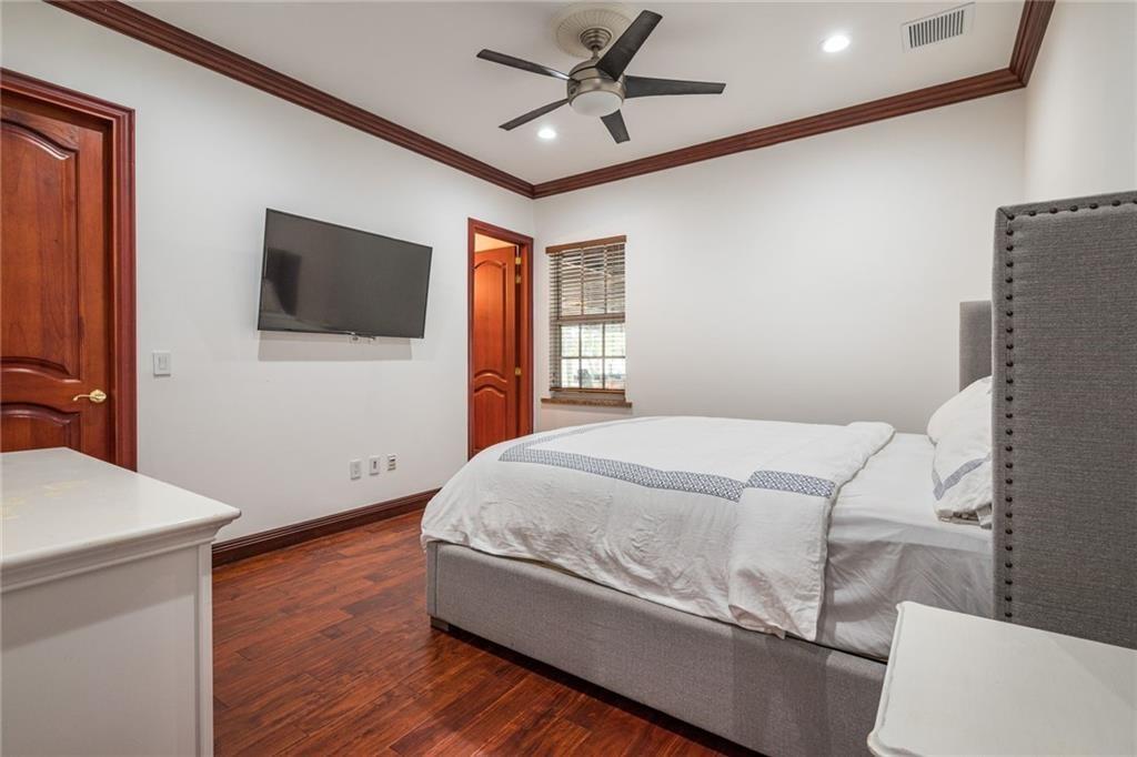 6465 Southwest 178th Avenue Southwest Ranches, FL 33331 - Photo 21 of 36 a bedroom with a bed and a flat screen tv