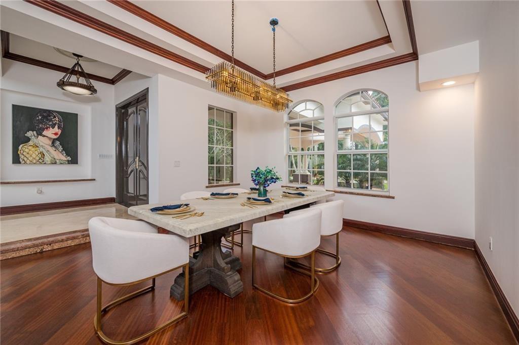 6465 Southwest 178th Avenue Southwest Ranches, FL 33331 - Photo 7 of 36 a view of a dining room with furniture window and wooden floor