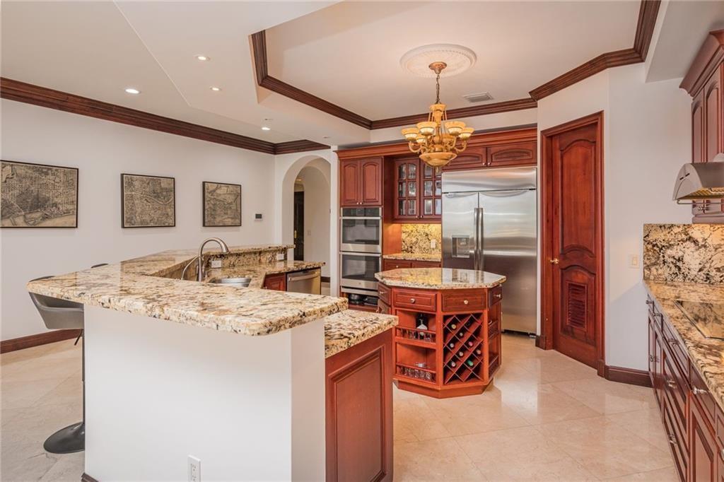 6465 Southwest 178th Avenue Southwest Ranches, FL 33331 - Photo 10 of 36 a dining hall with stainless steel appliances granite countertop a stove and a refrigerator
