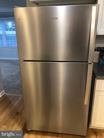 an empty room with wooden door