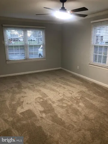 a view of empty room with windows