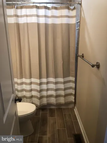a bathroom with a shower and bathtub