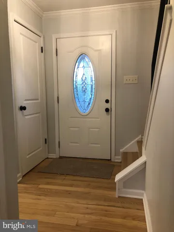 a view of entryway with wooden floor