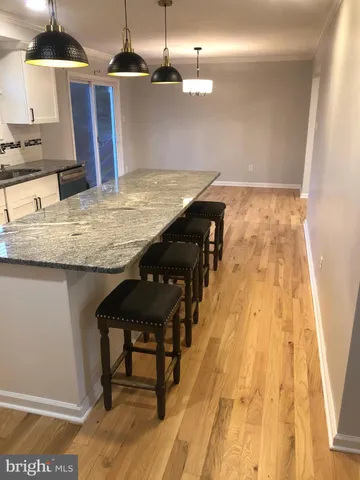 a kitchen with a table and chairs