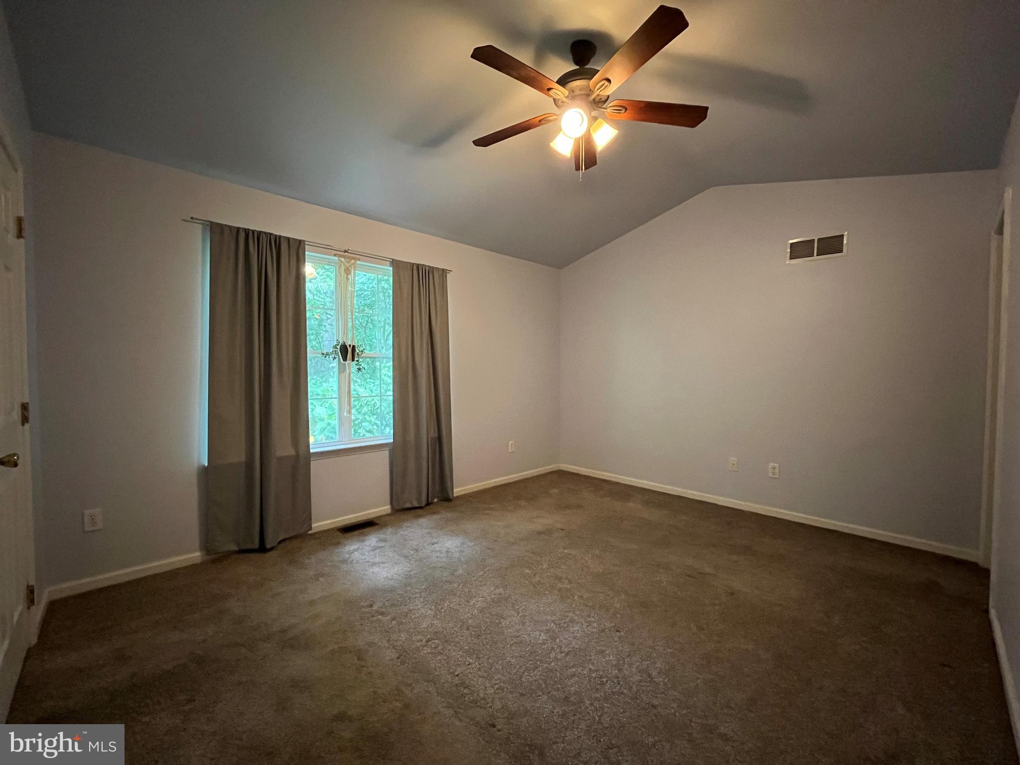 79 Mule Deer Court Elkton, MD 21921 - Photo 16 of 21 an empty room with chandelier fan and windows