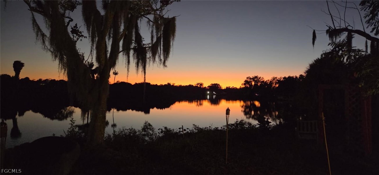 17520 Taylor Road Alva, FL 33920 - Photo 4 of 7 a view of a lake in between and trees