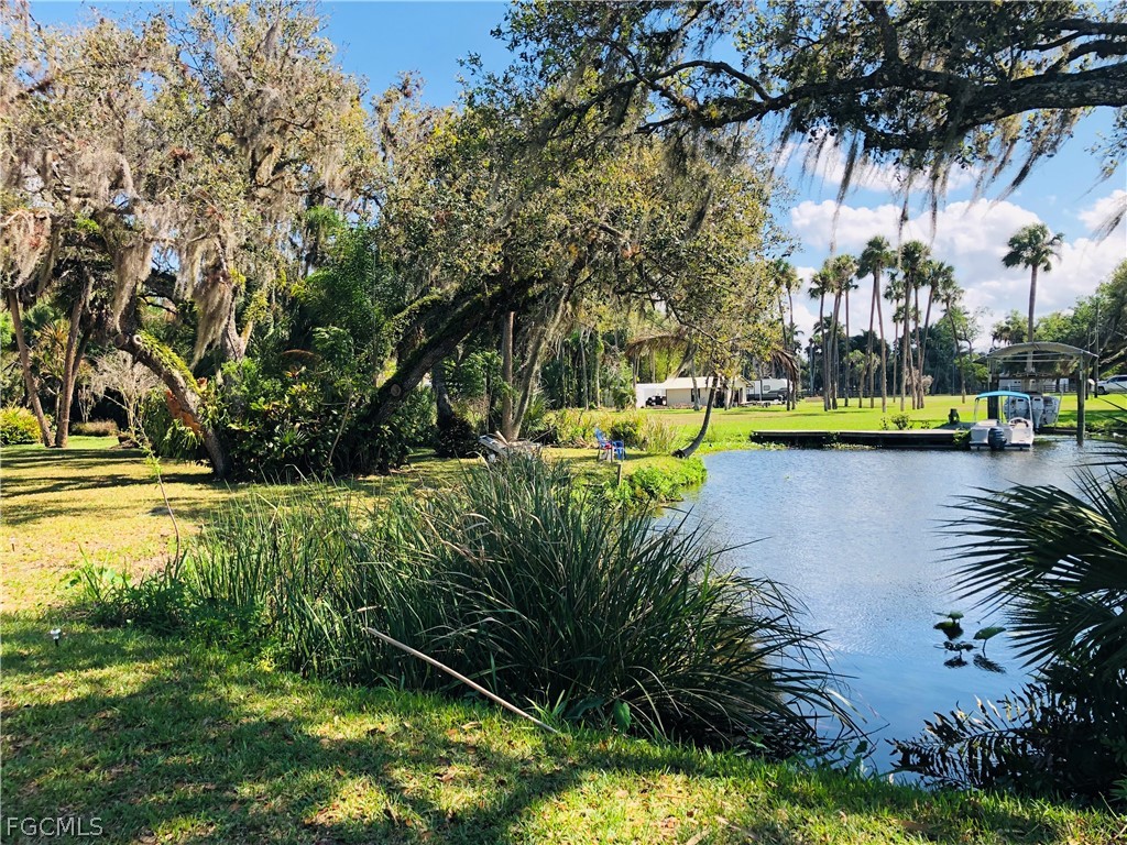 17520 Taylor Road Alva, FL 33920 - Photo 7 of 7 a view of a lake with houses