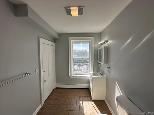 a bathroom with a bathtub a sink and a shower
