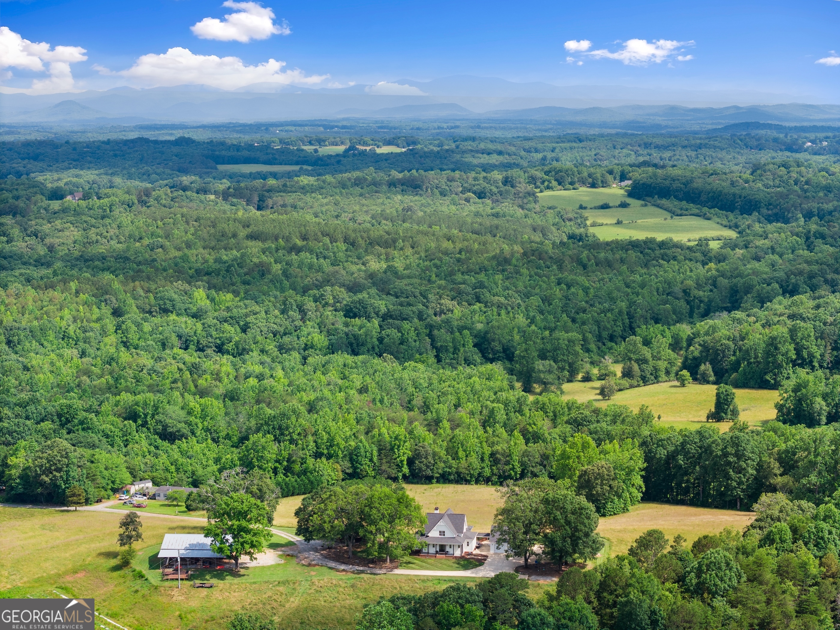 0 Hubert Harris Road Cornelia, GA 30531 - Photo 15 of 19 a view of a city with lush green forest