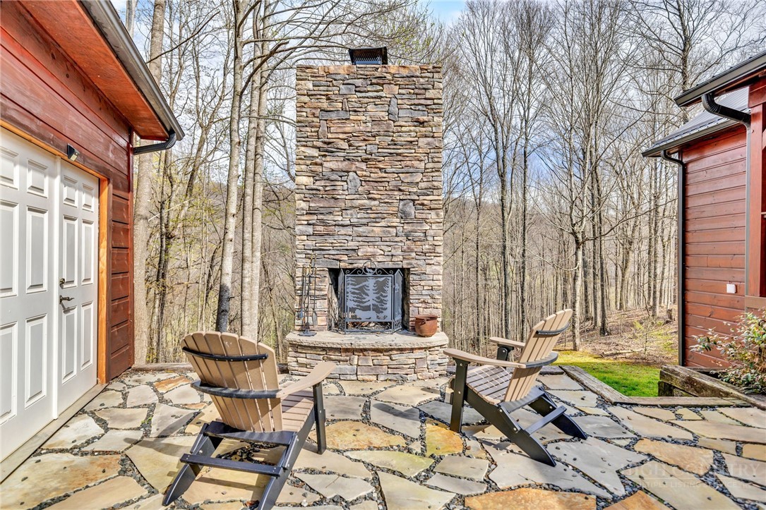 7994 3 Top Road Todd, NC 28684 - Photo 43 of 50 a front view of a house with chairs