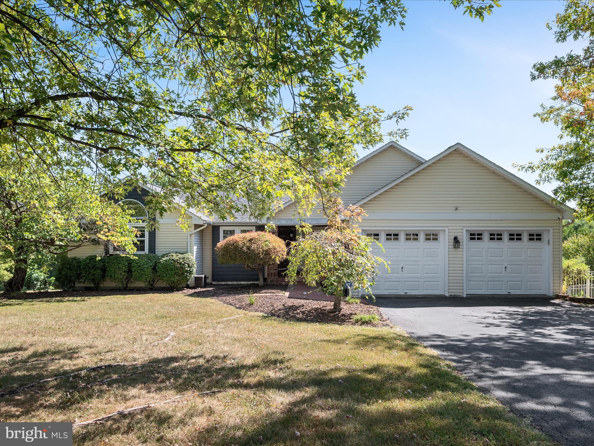 252 Punkin Ridge Drive Clear Brook, VA 22624 - Photo 1 of 80 a view of a house with a yard and garage