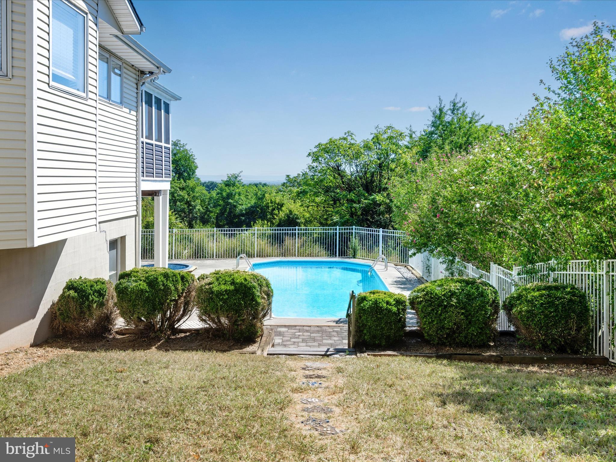 252 Punkin Ridge Drive Clear Brook, VA 22624 - Photo 19 of 80 a view of a garden with plants and a barbeque