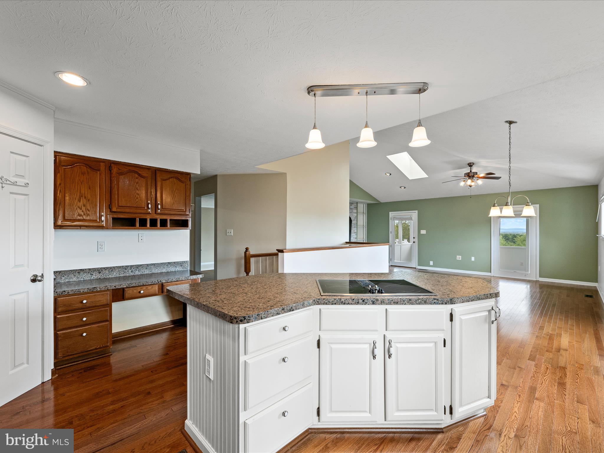 252 Punkin Ridge Drive Clear Brook, VA 22624 - Photo 42 of 80 a kitchen with granite countertop a sink a counter space appliances and cabinets