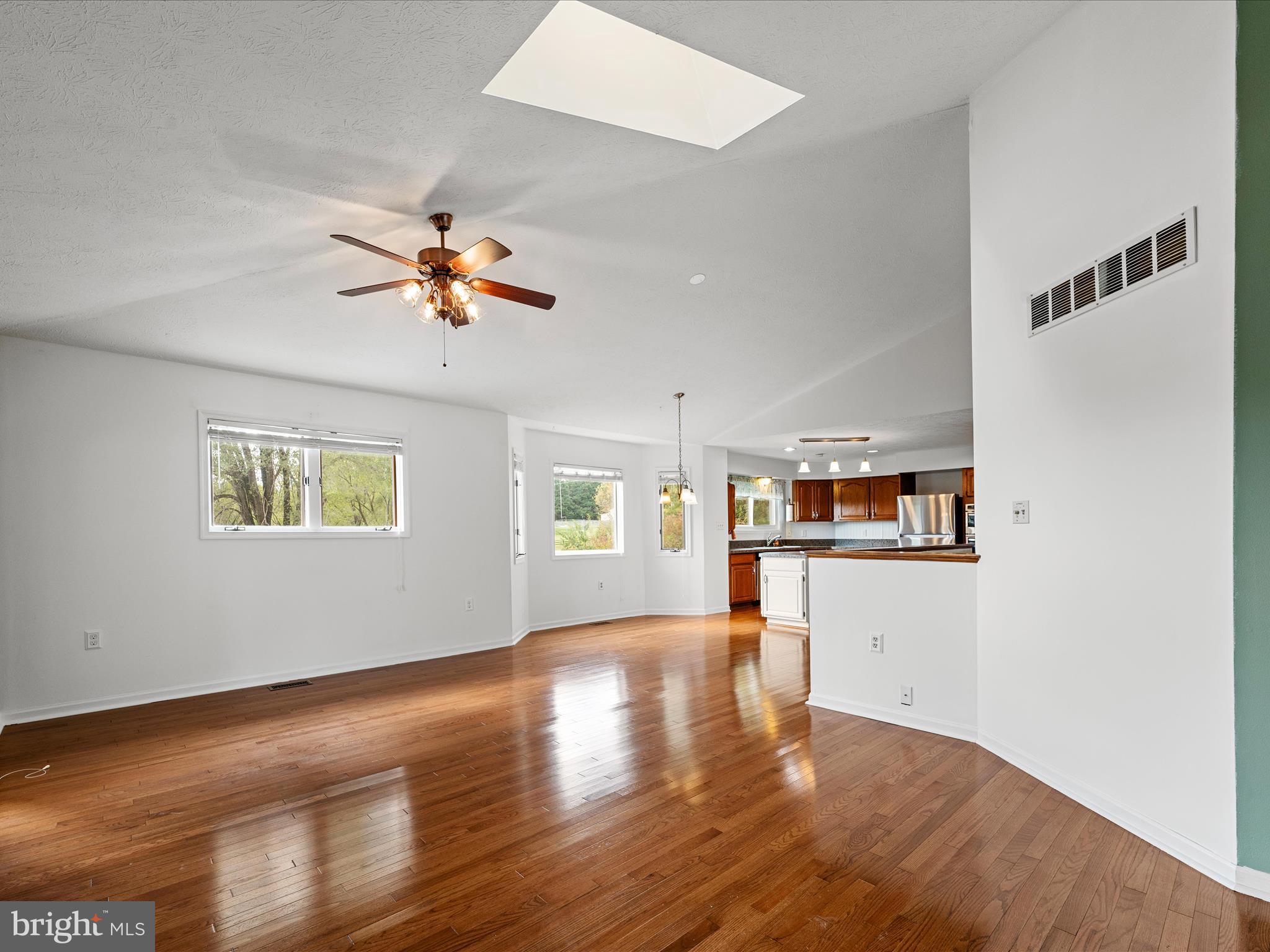 252 Punkin Ridge Drive Clear Brook, VA 22624 - Photo 47 of 80 a view of an empty room with window and wooden floor