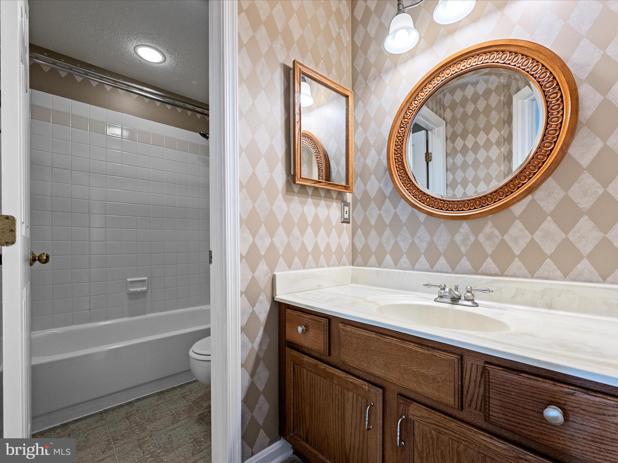 252 Punkin Ridge Drive Clear Brook, VA 22624 - Photo 58 of 80 a bathroom with a sink a toilet and a mirror